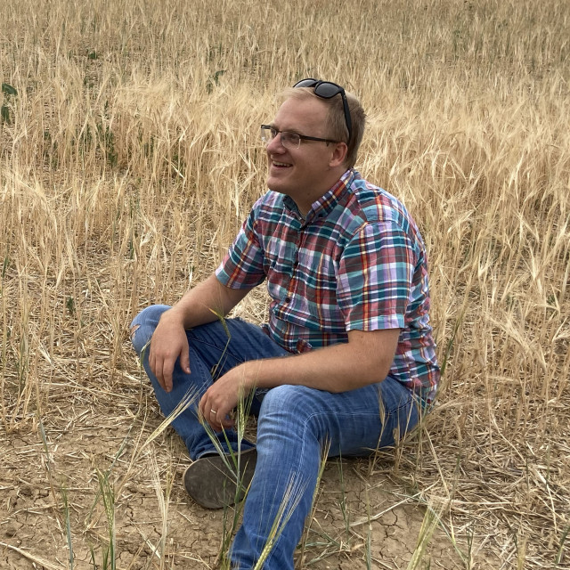 Joel in a wheat field